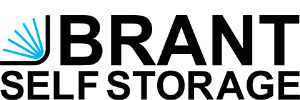 Logo for Brant Self Storage. The word “BRANT” is in bold black uppercase letters, with a blue stylized graphic on the left resembling an open book or abstract lines. SELF STORAGE appears below in black uppercase letters.